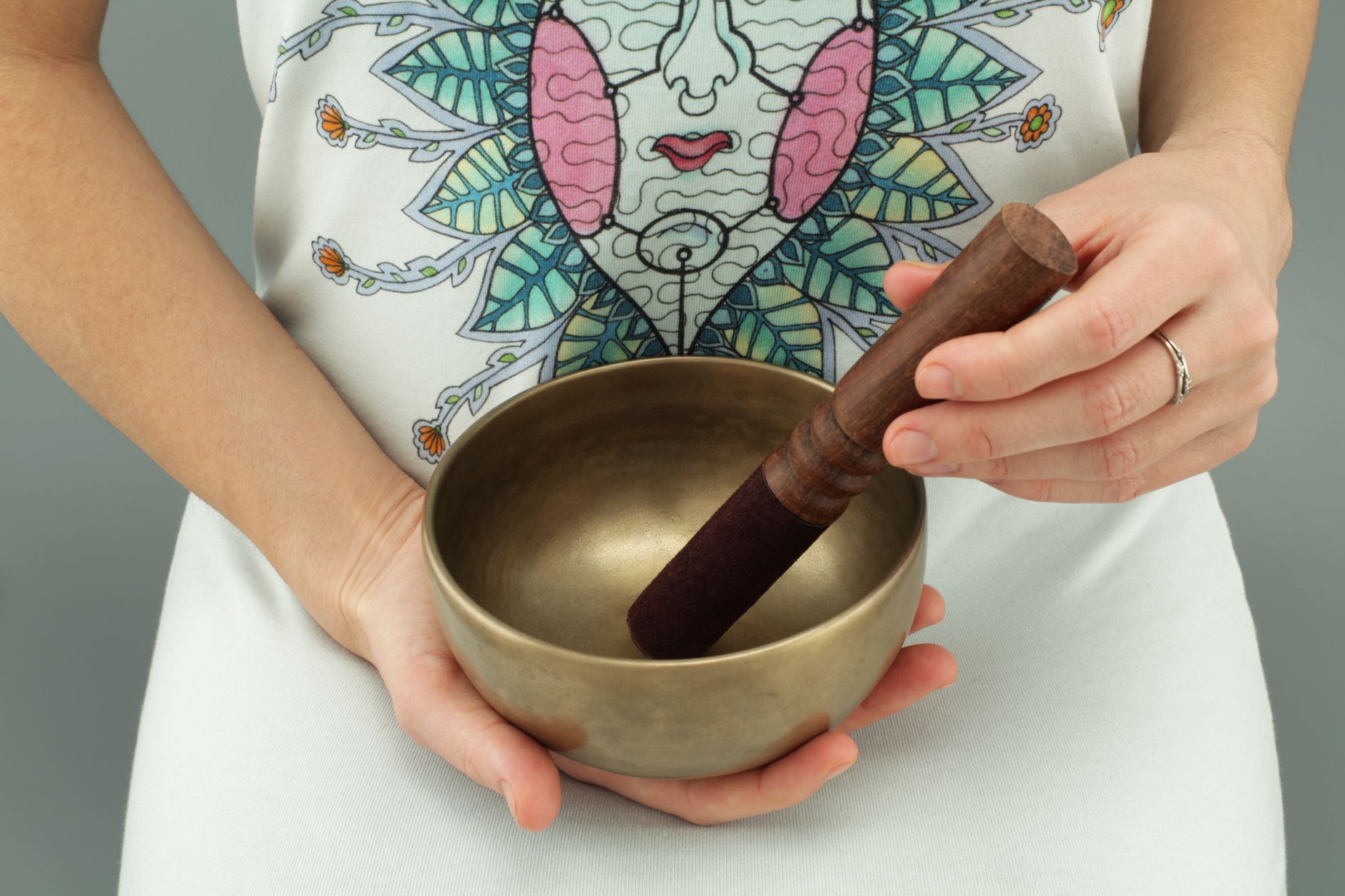 Tibetan singing bowl on wooden surface — meditation and sound healing instrument