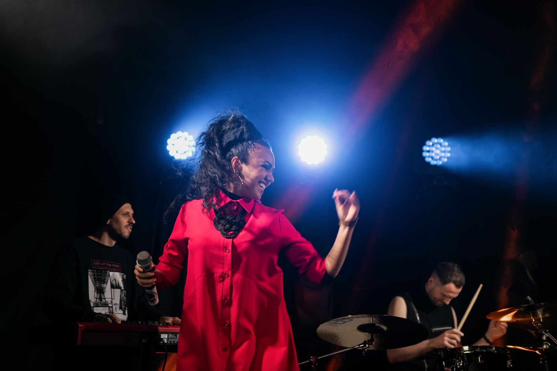 Theremin musician performing with hands near antennas, showing proper theremin technique
